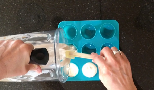 pouring treat batter into silicone mold