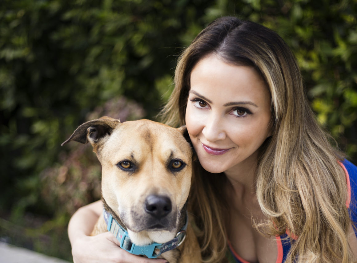 Shira Astrof of the Animal Rescue Mission with Pitbull Dog