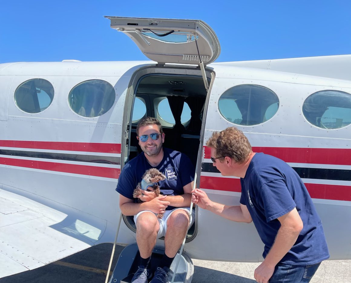 pet rescue pilots with dog