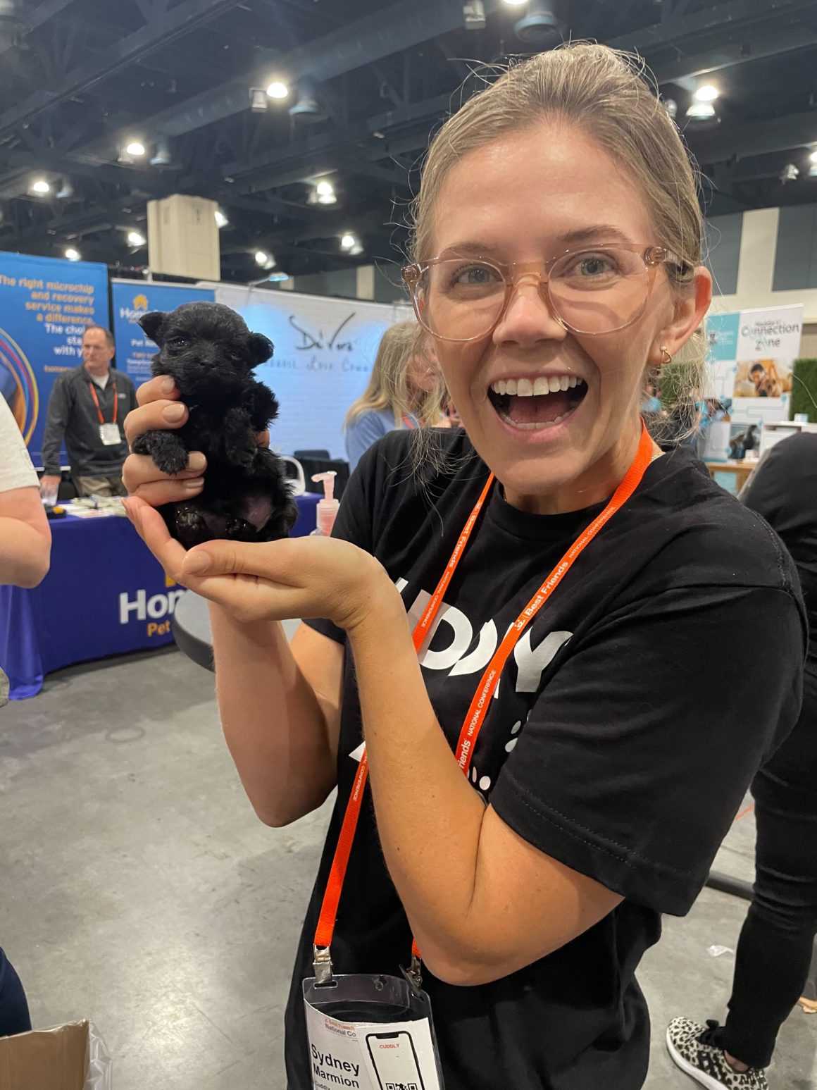 girl holding tiny puppy